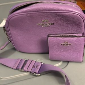 Bright purple leather crossbody coach bag . Pebbled leather. Previously loved
